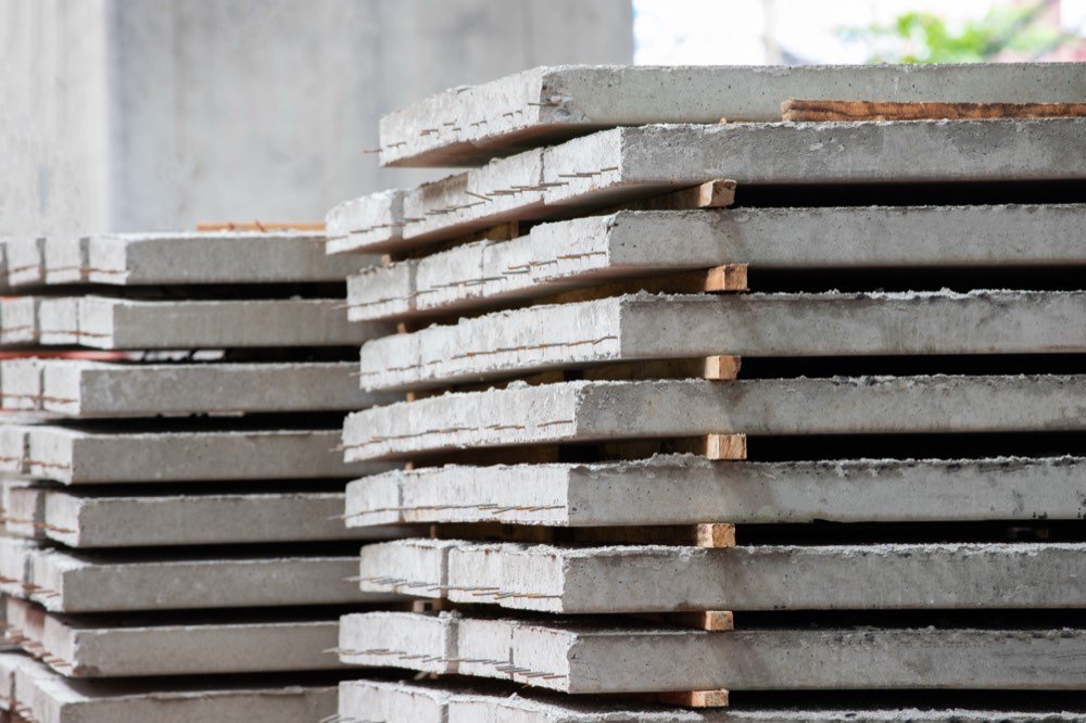 Stacked precast concrete floor panels