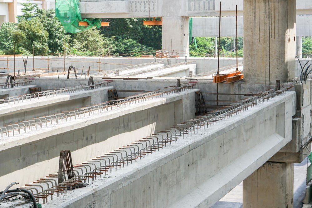 Precast concrete beams with steel reinforcement on site